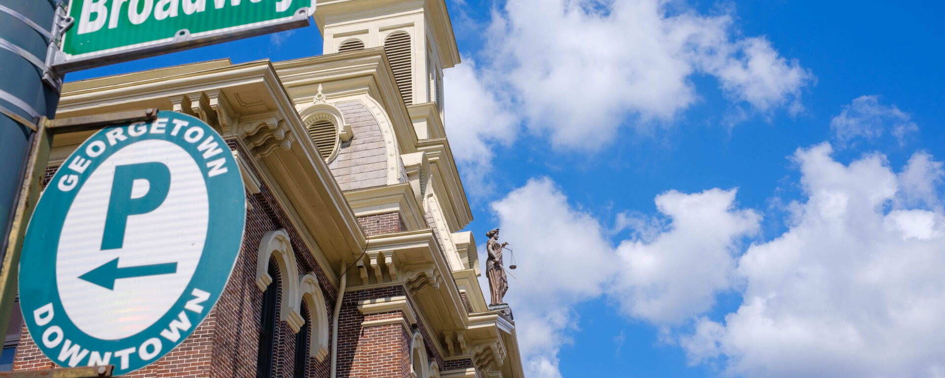 Architectural detail of a historic building against a blue sky.